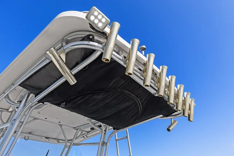  Yacht Photos Pics 2004 Hydra-Sports Vector 3300 CC with rod holders against blue sky.