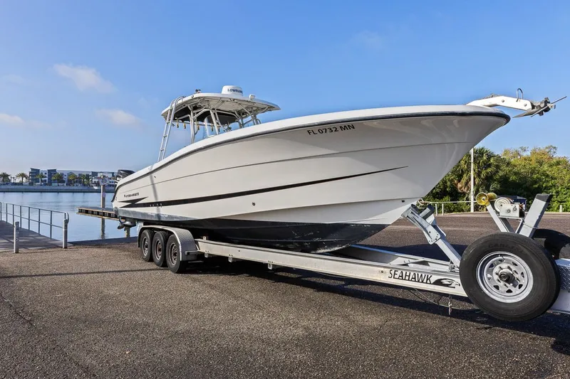  Yacht Photos Pics 2004 Hydra-Sports Vector 3300 CC on trailer by the water.