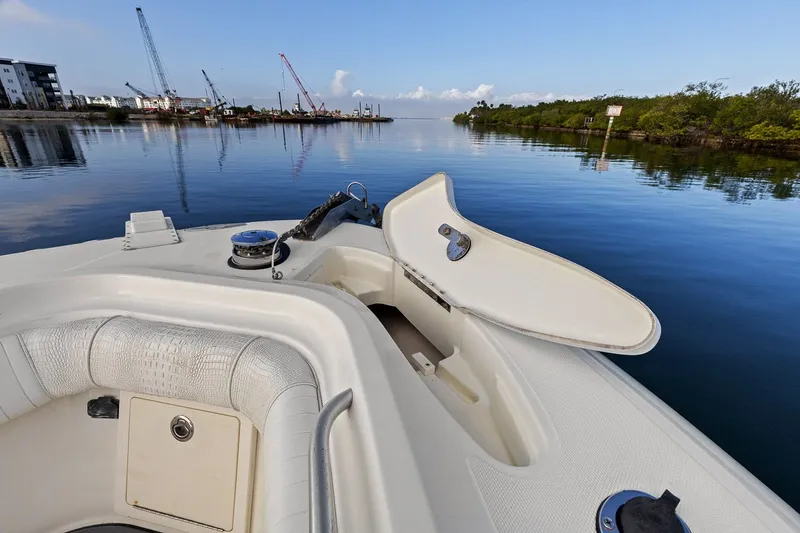  Yacht Photos Pics 2004 Hydra-Sports Vector 3300 CC on calm water with open hatch.