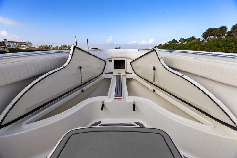  Yacht Photos Pics 2004 Hydra-Sports Vector 3300 CC boat with open storage compartments.