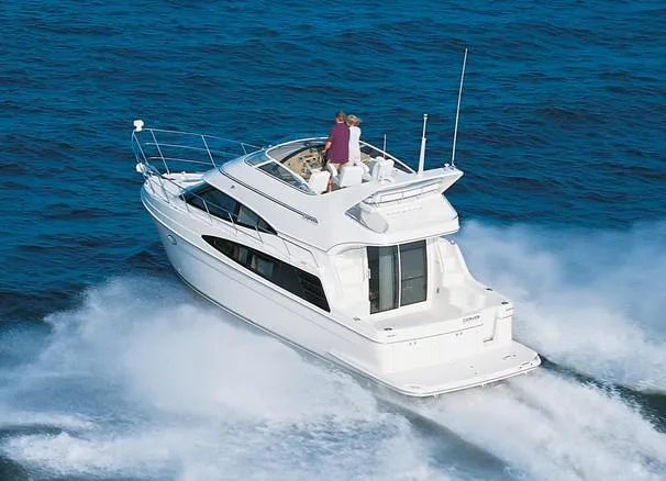  Yacht Photos Pics 2004 Carver 360 Sport Sedan cruising on open water, showcasing sleek design and performance.