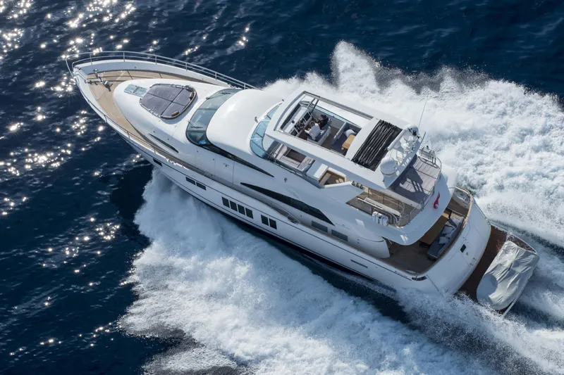  Yacht Photos Pics 2015 Fairline Squadron 78 yacht cruising on open water, aerial view.