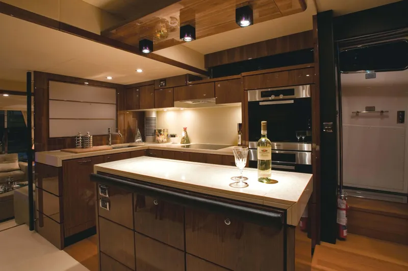  Yacht Photos Pics Luxurious kitchen interior of 2015 Fairline Squadron 78 yacht with modern amenities.