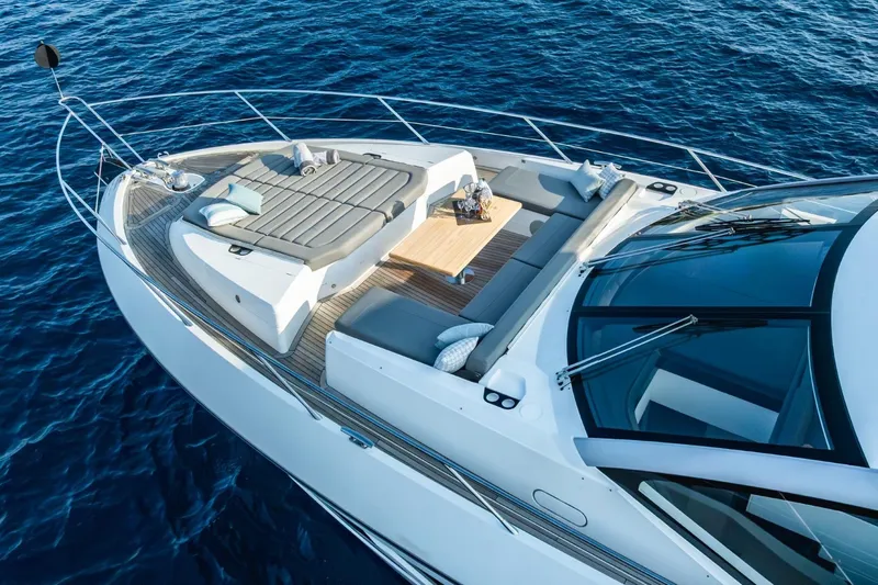 Jam Yacht Photos Pics 2018 Sunseeker 74 Sport Yacht with luxurious deck seating and sunbathing area on open water.