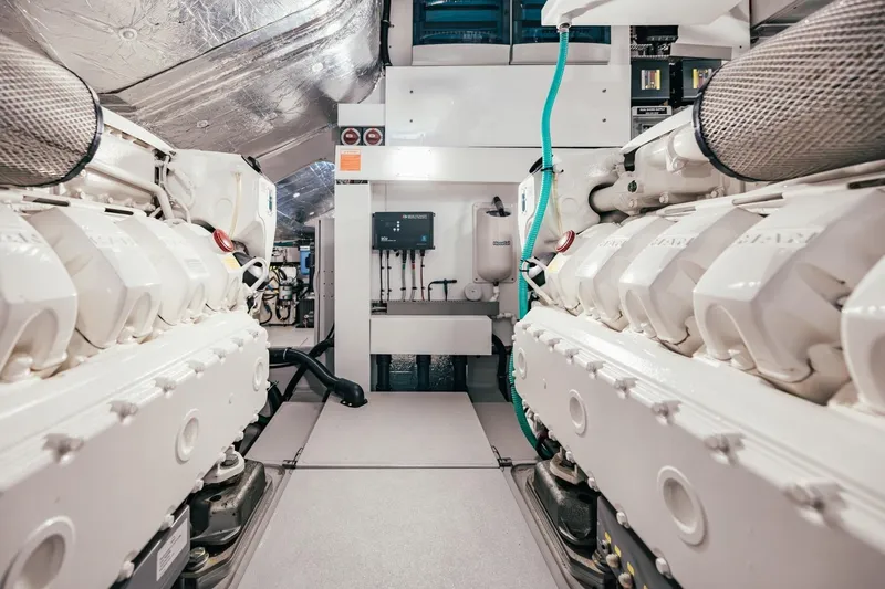 Jam Yacht Photos Pics Engine room of 2018 Sunseeker 74 Sport Yacht, showcasing dual engines and mechanical systems.