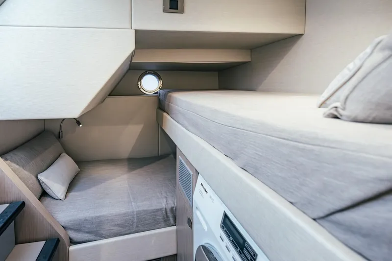 Jam Yacht Photos Pics Interior of 2018 Sunseeker 74 Sport Yacht with cozy bunk beds and porthole.