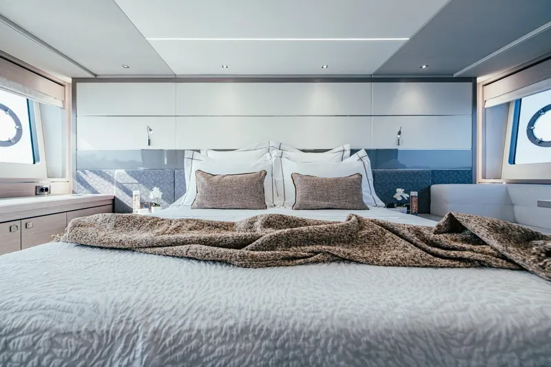 Jam Yacht Photos Pics Luxurious bedroom interior of 2018 Sunseeker 74 Sport Yacht with elegant bedding and modern design.