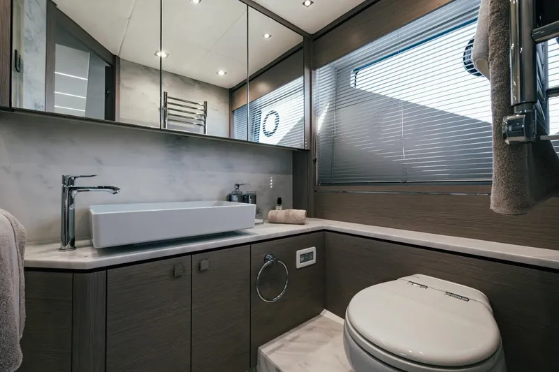 Jam Yacht Photos Pics Luxurious bathroom interior of 2018 Sunseeker 74 Sport Yacht with modern fixtures.