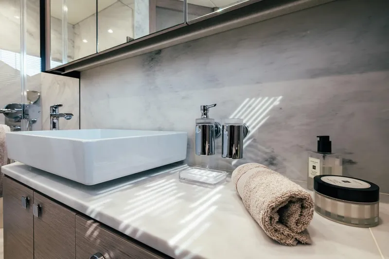 Jam Yacht Photos Pics Luxurious bathroom vanity on 2018 Sunseeker 74 Sport Yacht with modern sink and elegant accessories.