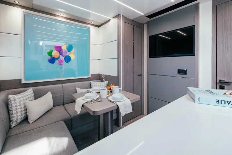 Jam Yacht Photos Pics Luxurious interior of 2018 Sunseeker 74 Sport Yacht with modern decor and dining area.