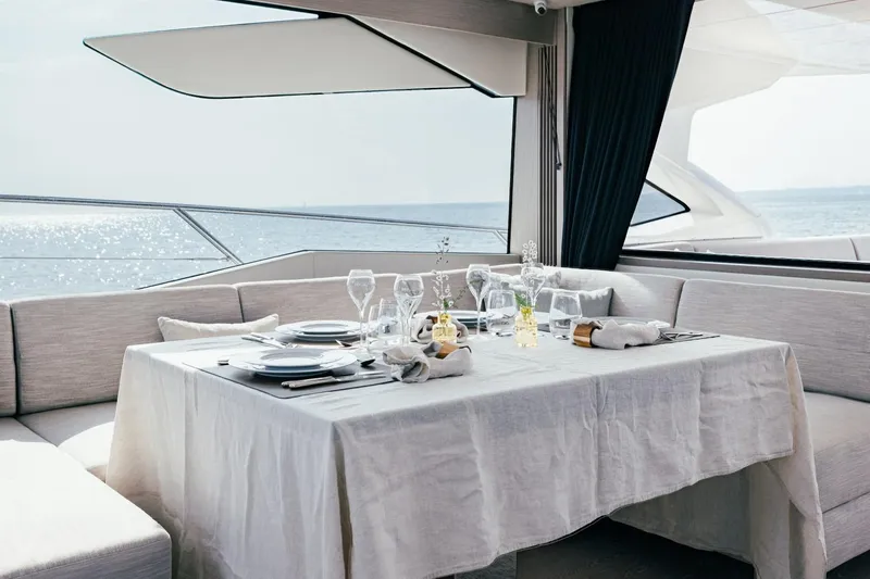 Jam Yacht Photos Pics Luxurious dining setup on 2018 Sunseeker 74 Sport Yacht with ocean view.