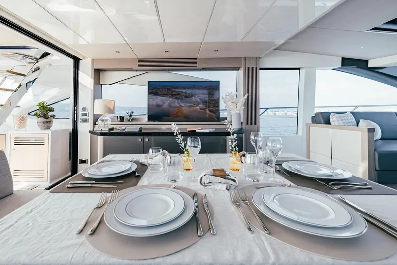 Jam Yacht Photos Pics Luxurious dining area on a 2018 Sunseeker 74 Sport Yacht with elegant table setting.