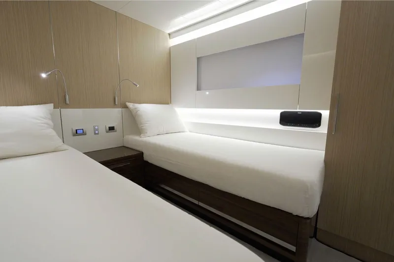  Yacht Photos Pics Luxurious twin cabin interior of 2024 Arcadia Yachts A85, featuring modern design and ambient lighting.