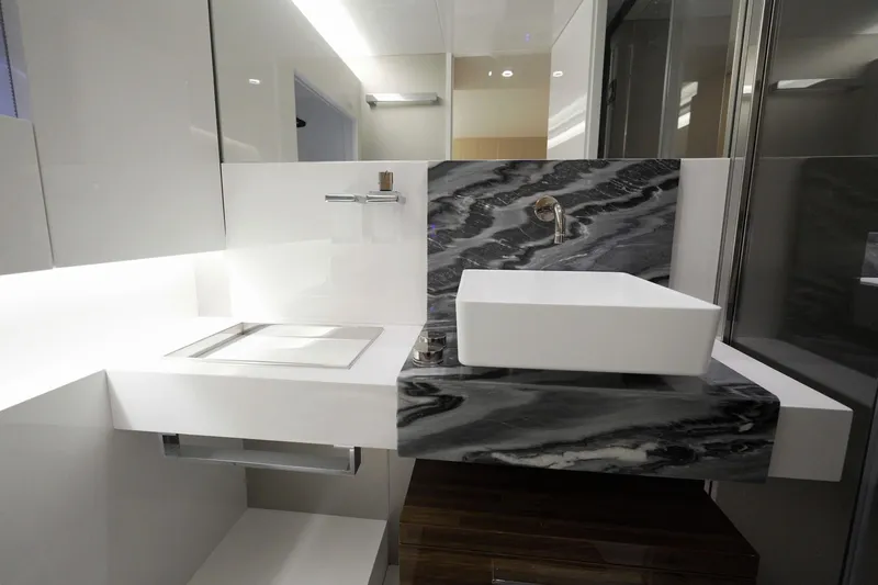  Yacht Photos Pics Luxurious bathroom interior on 2024 Arcadia Yachts A85, featuring modern sink and elegant design.