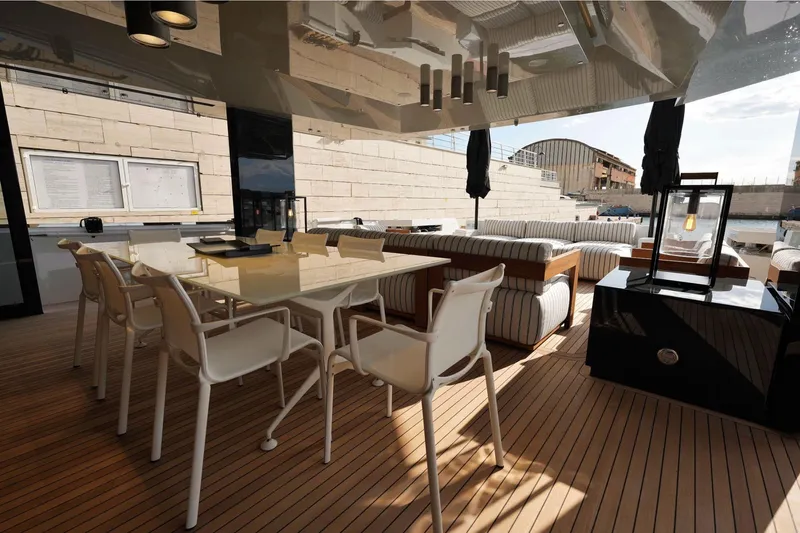 Yacht Photos Pics Luxurious 2024 Arcadia Yachts A85 interior with elegant dining area and modern furnishings.