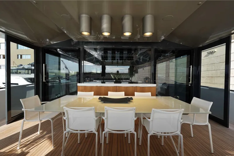  Yacht Photos Pics Luxurious dining area on 2024 Arcadia Yachts A85 with modern design and elegant seating.