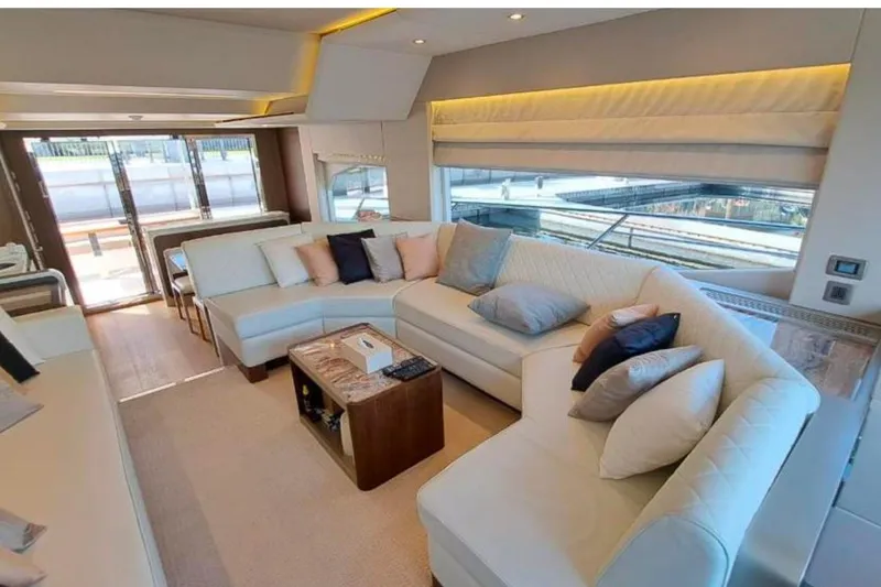  Yacht Photos Pics Luxurious interior of 2018 Gulf Craft Majesty 62 yacht with elegant seating and modern decor.