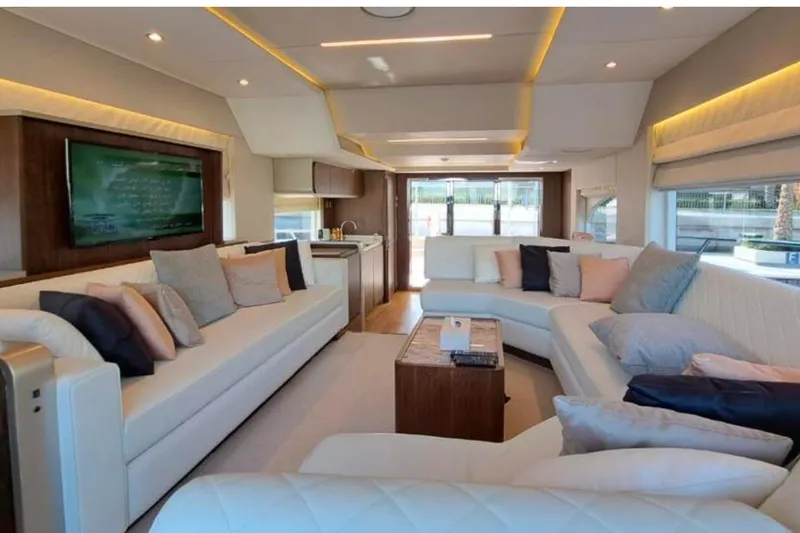 Yacht Photos Pics Luxurious interior of 2018 Gulf Craft Majesty 62 yacht with elegant seating and modern decor.