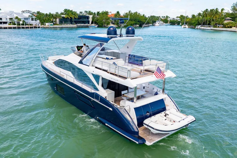  Yacht Photos Pics Luxury Azimut 60 Fly yacht cruising on a scenic waterway, 2020 model.