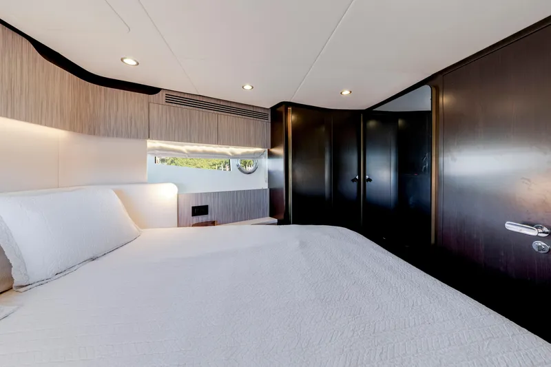  Yacht Photos Pics Luxurious bedroom interior of 2020 Azimut 60 Fly yacht with modern design and elegant finishes.