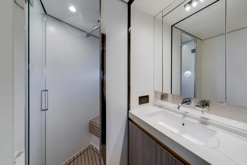  Yacht Photos Pics Luxurious bathroom interior on 2020 Azimut 60 Fly yacht, featuring modern sink and shower.