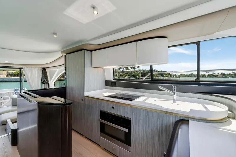  Yacht Photos Pics Modern kitchen interior of 2020 Azimut 60 Fly yacht with sleek design and large windows.