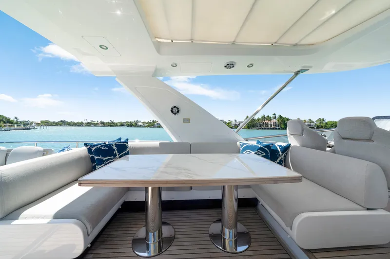  Yacht Photos Pics Luxurious seating area on 2020 Azimut 60 Fly yacht with ocean view.
