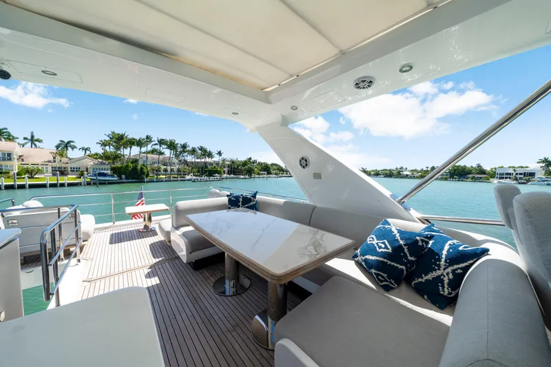  Yacht Photos Pics Luxurious 2020 Azimut 60 Fly yacht deck with elegant seating and scenic waterfront view.
