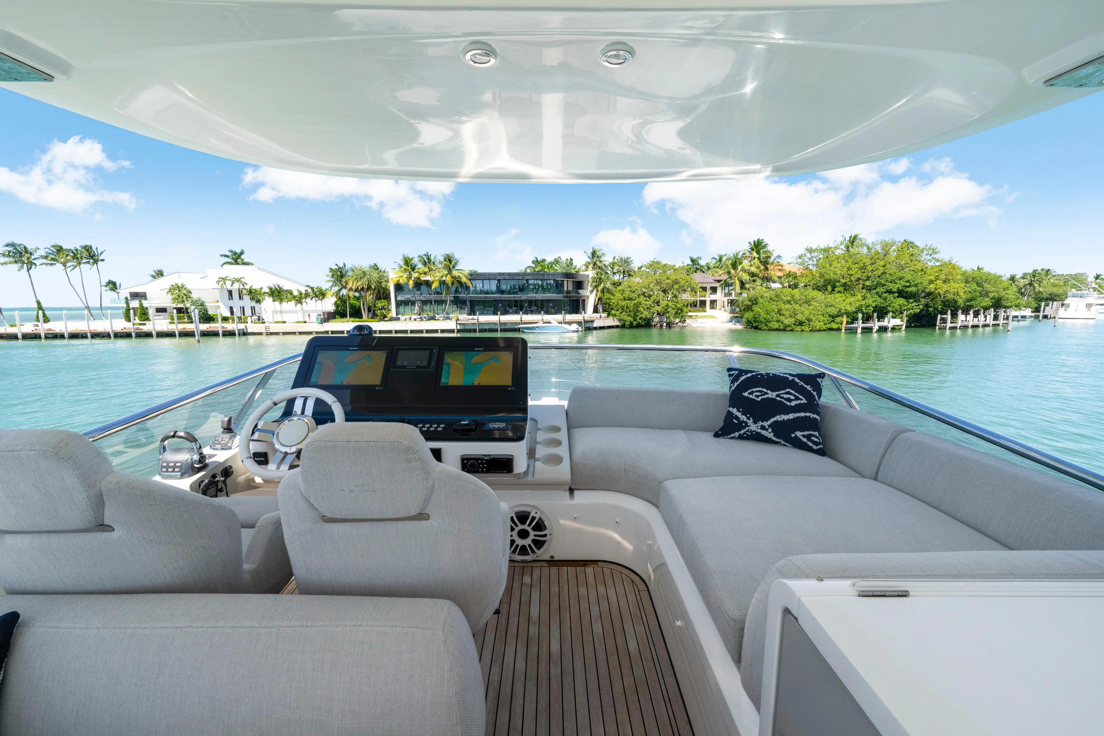  Yacht Photos Pics Luxurious 2020 Azimut 60 Fly yacht interior with plush seating and scenic waterfront view.