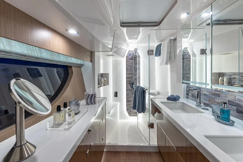 Oasis Yacht Photos Pics Luxurious bathroom in 2023 Horizon PC60 yacht with modern fixtures and elegant design.