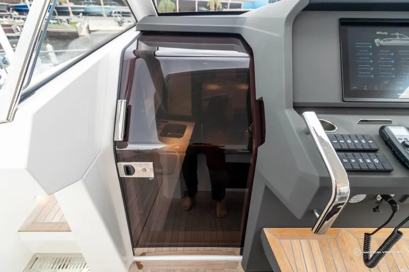  Yacht Photos Pics Windy SR44 SX 2022 boat interior with control panel and cabin door.