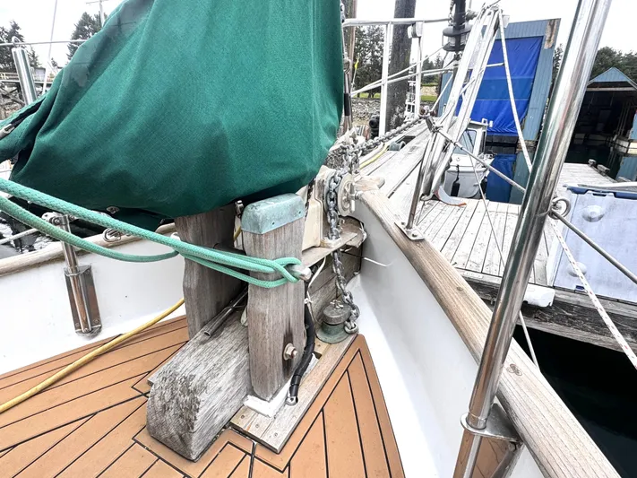  Yacht Photos Pics 1980 Hans Christian 38 MKII sailboat deck with green cover and wooden details at marina.