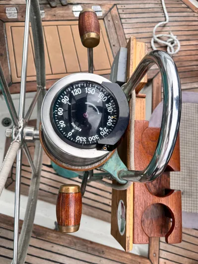  Yacht Photos Pics Compass and wooden helm on 1980 Hans Christian 38 MKII sailboat deck.