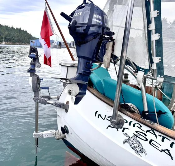  Yacht Photos Pics 1980 Hans Christian 38 MKII sailboat with Yamaha outboard motor and Canadian flag in harbor.