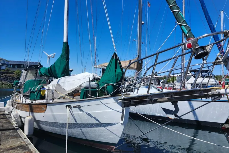 Yacht Photos Pics 1980 Hans Christian 38 MKII sailboat docked at marina, clear blue sky.