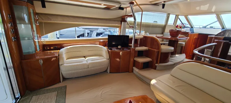 Off The Road Yacht Photos Pics Luxurious interior of 2006 Viking Sport Cruisers 61 Flybridge yacht with elegant seating and modern amenities.