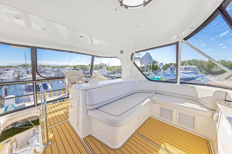 El Matador Yacht Photos Pics Interior of 2007 Silverton 45 Convertible yacht with spacious seating and marina view.