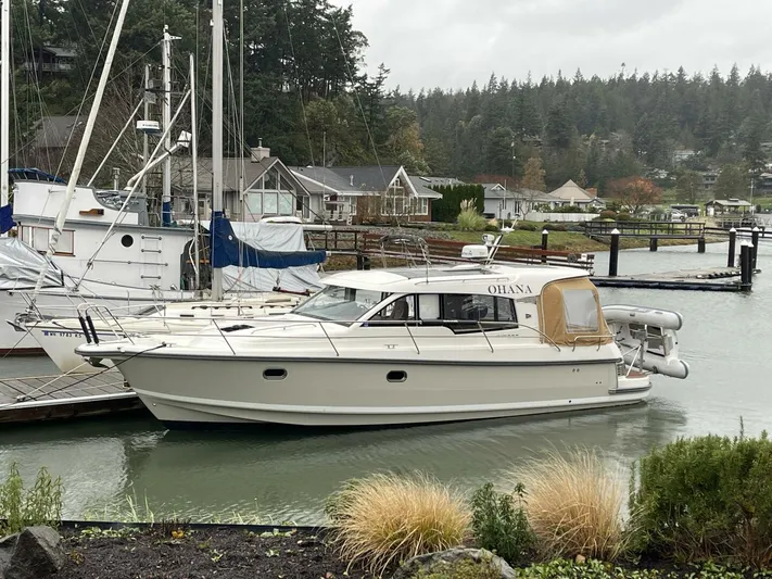 Ohana Yacht Photos Pics 2019 Nimbus 365 Coupe docked in a scenic marina setting.