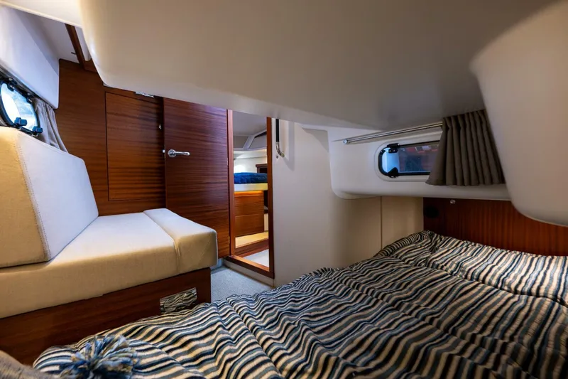 Ohana Yacht Photos Pics Interior of 2019 Nimbus 365 Coupe, featuring cozy cabin with bed and seating area.