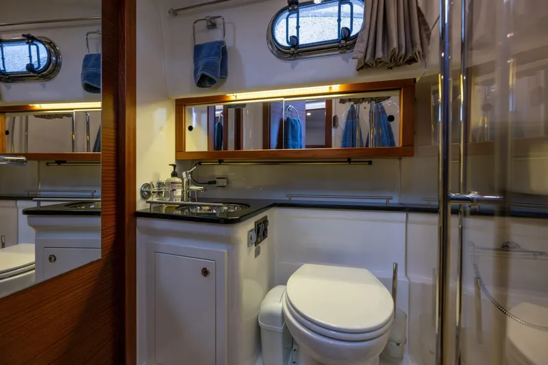 Ohana Yacht Photos Pics Bathroom interior of 2019 Nimbus 365 Coupe yacht, featuring modern fixtures and elegant design.