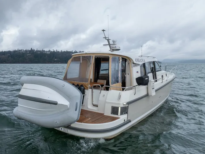 Ohana Yacht Photos Pics 2019 Nimbus 365 Coupe boat cruising on a cloudy day.