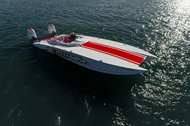  Yacht Photos Pics 2022 HellKats 32 powerboat with red stripes on open water.