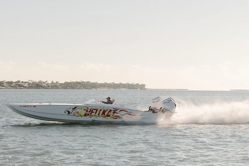  Yacht Photos Pics 2022 HellKats 32 speedboat racing on open water with vibrant graphics.