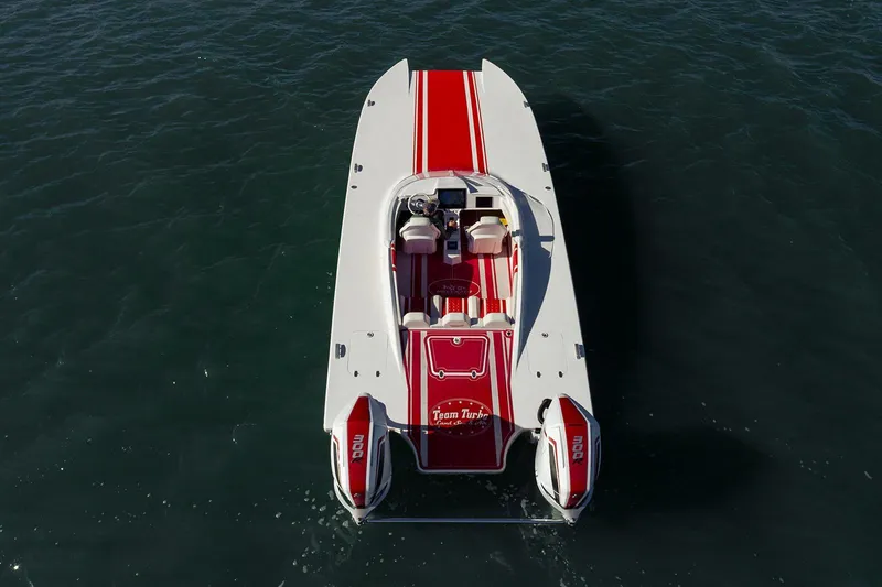  Yacht Photos Pics 2022 HellKats 32 boat with red and white design on water.