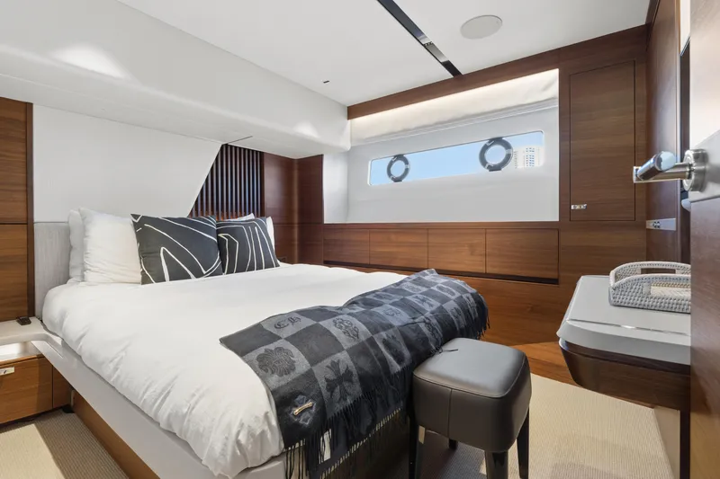  Yacht Photos Pics Luxurious bedroom interior of 2022 Princess Y85 yacht with modern design and elegant furnishings.