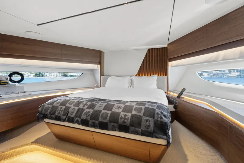  Yacht Photos Pics Luxurious bedroom interior of 2022 Princess Y85 yacht with modern design and large windows.