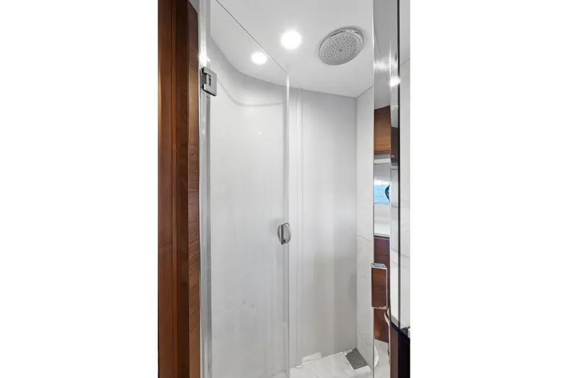  Yacht Photos Pics Luxurious shower in 2022 Princess Y85 yacht with sleek design and modern fixtures.