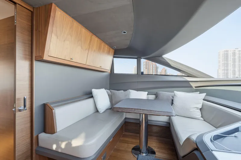  Yacht Photos Pics Luxurious interior of 2022 Princess Y85 yacht with elegant seating and cityscape view.
