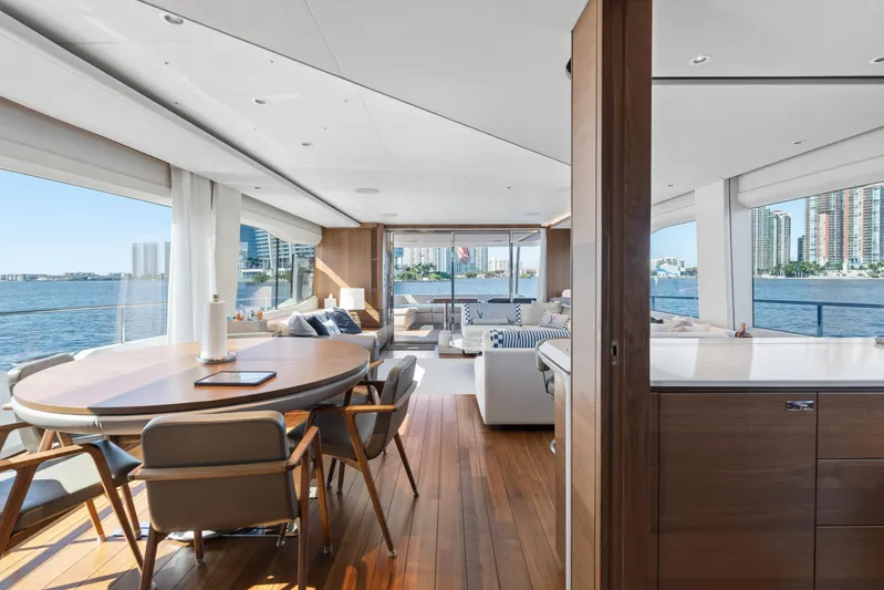  Yacht Photos Pics Luxurious interior of 2022 Princess Y85 yacht with elegant dining area and waterfront views.