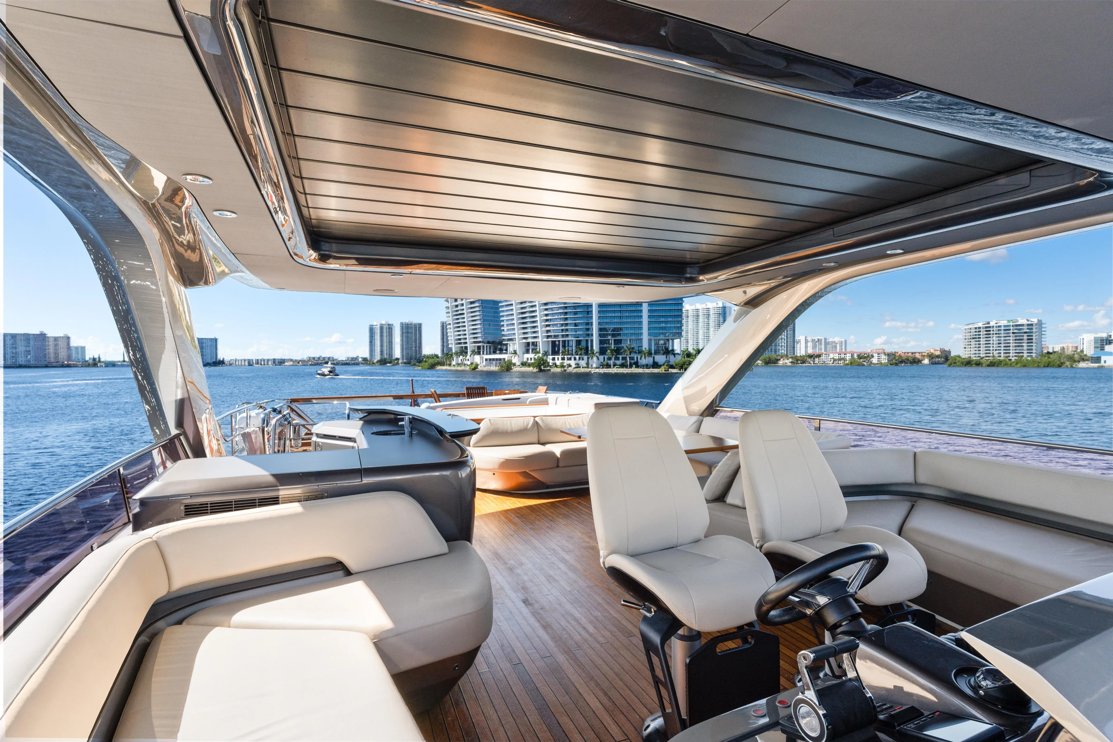  Yacht Photos Pics Luxurious 2022 Princess Y85 yacht interior with modern seating and scenic waterfront view.